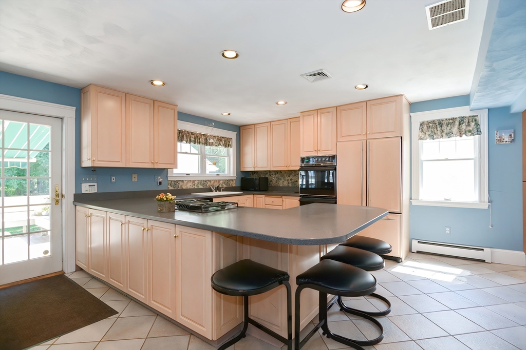 207 Lawrence Road Medford, MA 02155 - Photo 11 of 42 a kitchen with a sink cabinets and window