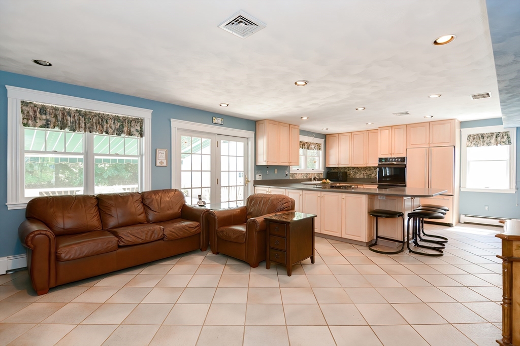 207 Lawrence Road Medford, MA 02155 - Photo 12 of 42 a living room with furniture and kitchen view