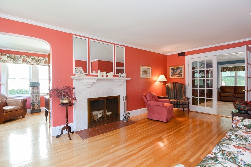 207 Lawrence Road Medford, MA 02155 - Photo 19 of 42 a bedroom with furniture and a fireplace