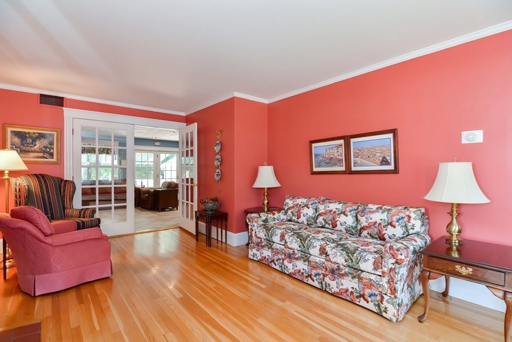 207 Lawrence Road Medford, MA 02155 - Photo 20 of 42 a living room with furniture and a wooden floor
