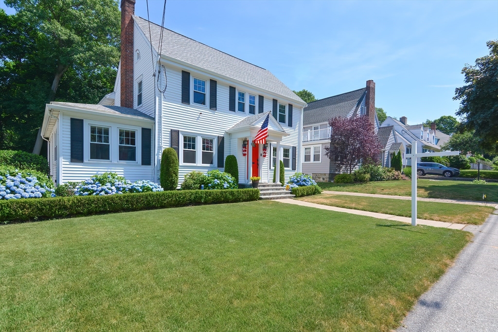 207 Lawrence Road Medford, MA 02155 - Photo 2 of 42 a view of house with a yard and potted plants