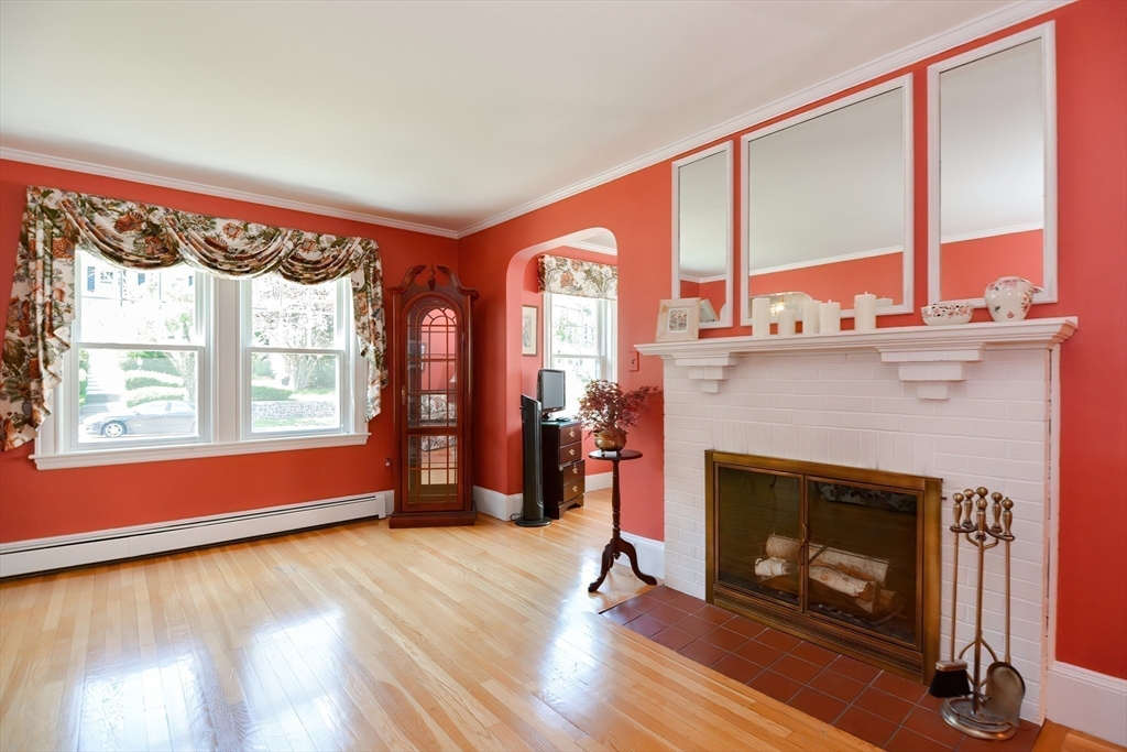 207 Lawrence Road Medford, MA 02155 - Photo 21 of 42 a living room with furniture and a fireplace