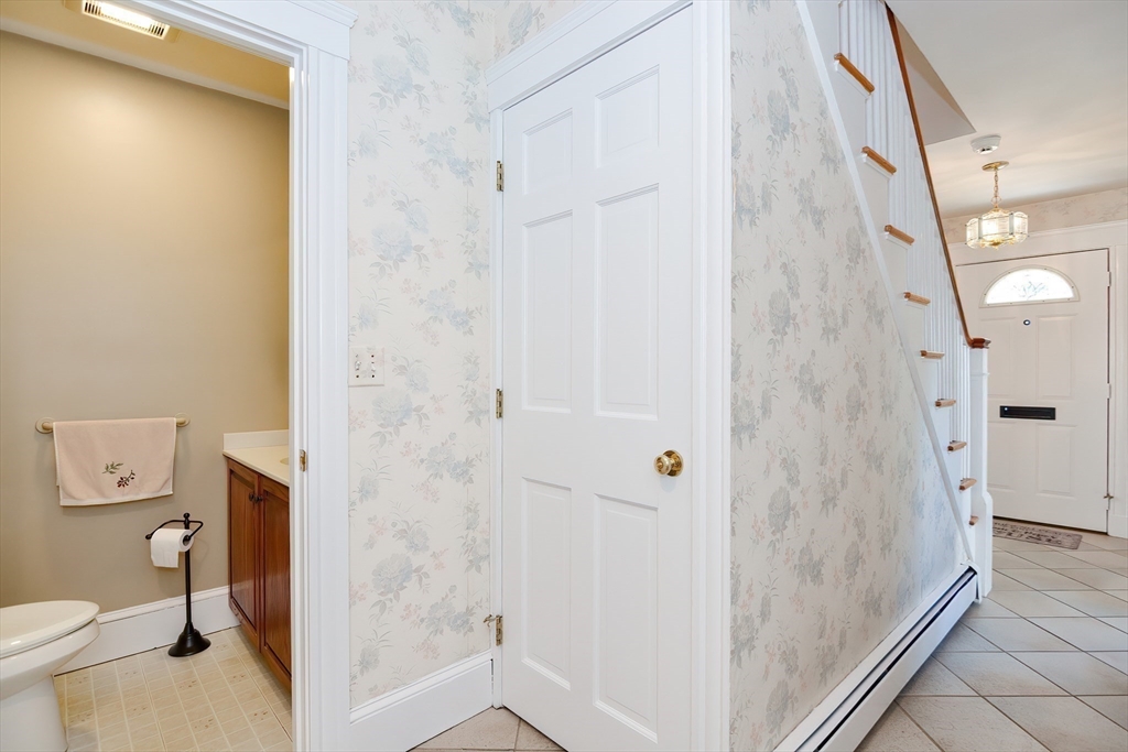 207 Lawrence Road Medford, MA 02155 - Photo 22 of 42 a bathroom with a granite countertop shower and a toilet