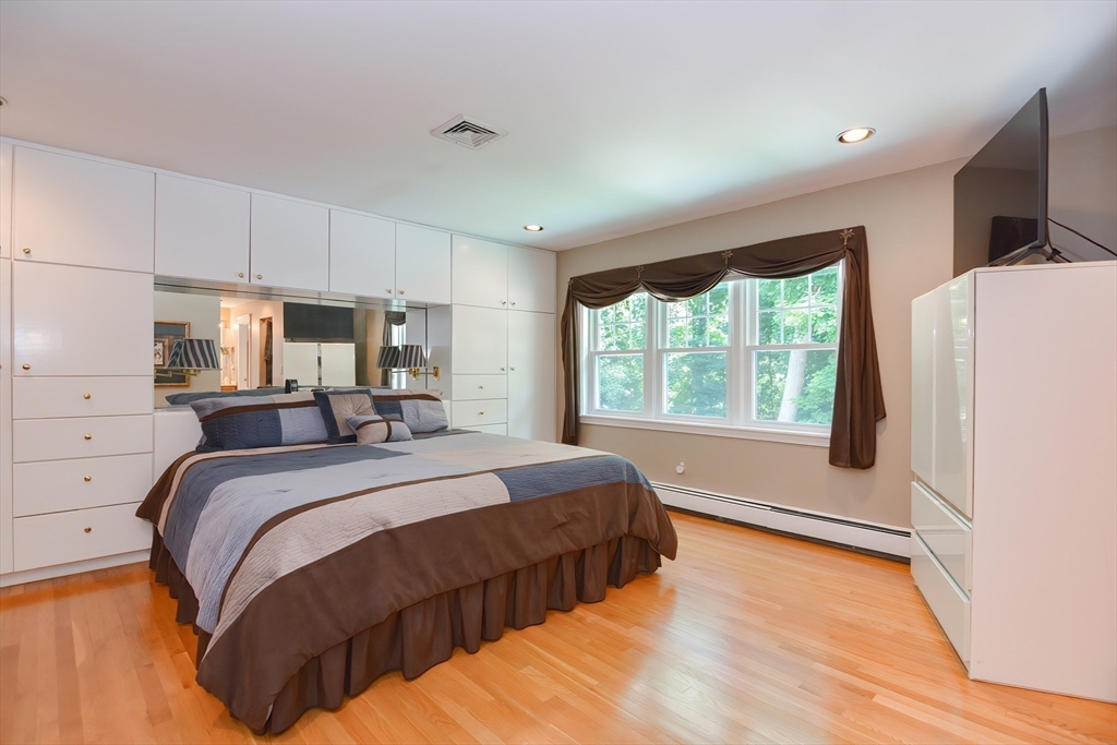 207 Lawrence Road Medford, MA 02155 - Photo 26 of 42 a bed sitting in a bedroom next to a window