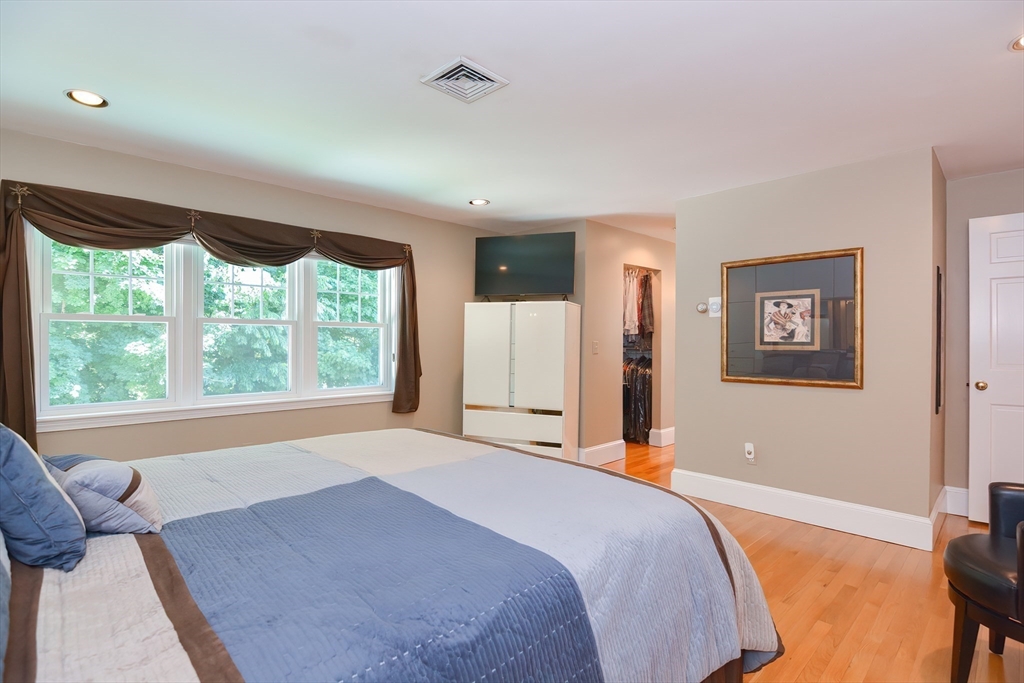 207 Lawrence Road Medford, MA 02155 - Photo 27 of 42 a bedroom with a large bed and a large window