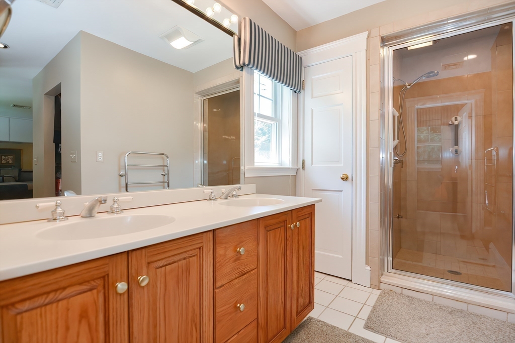 207 Lawrence Road Medford, MA 02155 - Photo 28 of 42 a bathroom with a sink and a mirror