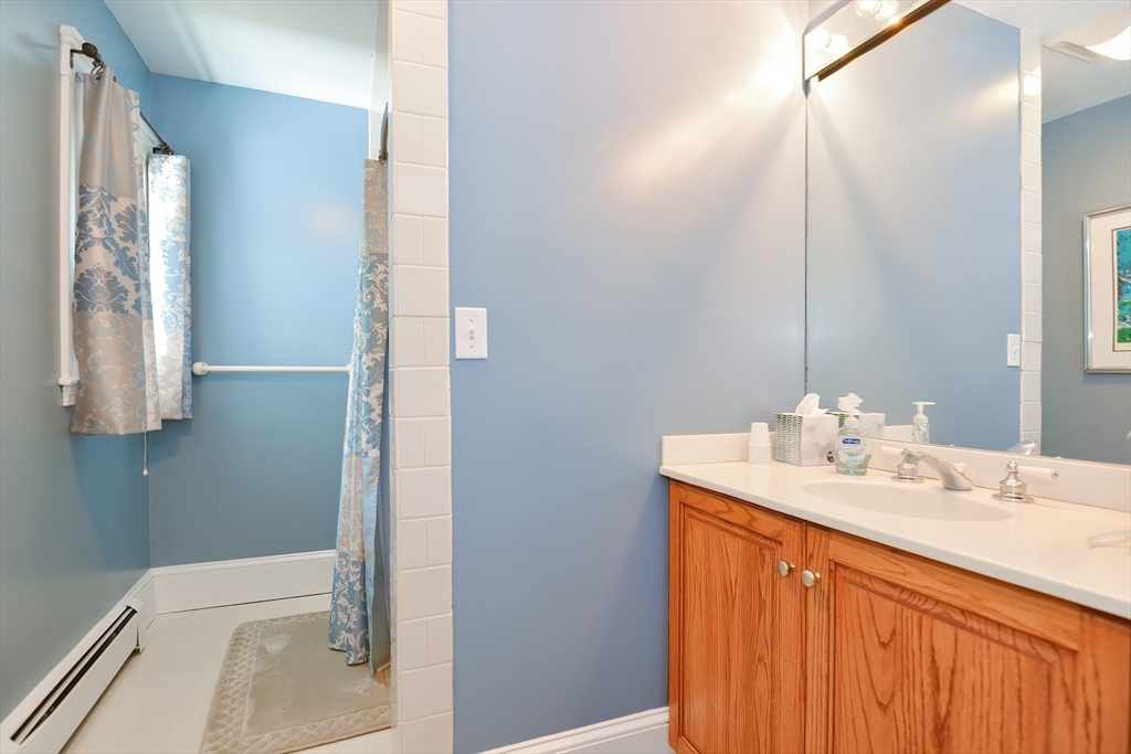 207 Lawrence Road Medford, MA 02155 - Photo 31 of 42 a bathroom with a sink and a mirror