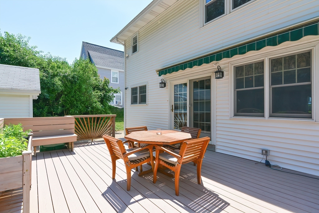 207 Lawrence Road Medford, MA 02155 - Photo 8 of 42 a view of a patio with a table and chairs
