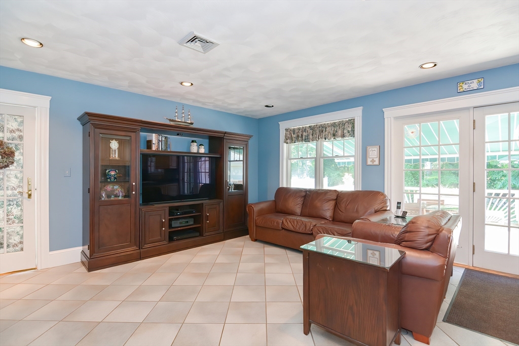 207 Lawrence Road Medford, MA 02155 - Photo 10 of 42 a living room with furniture and a flat screen tv