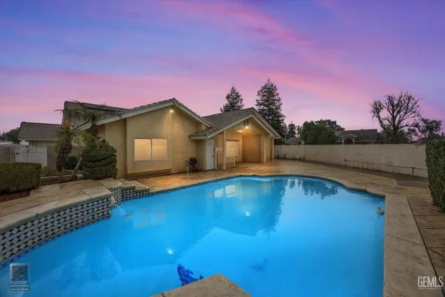 a front view of house with yard and outdoor seating