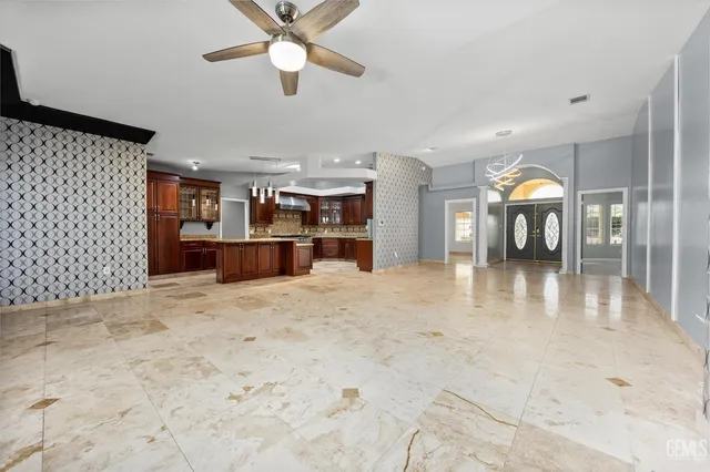 a view of a kitchen with a stove and cabinets