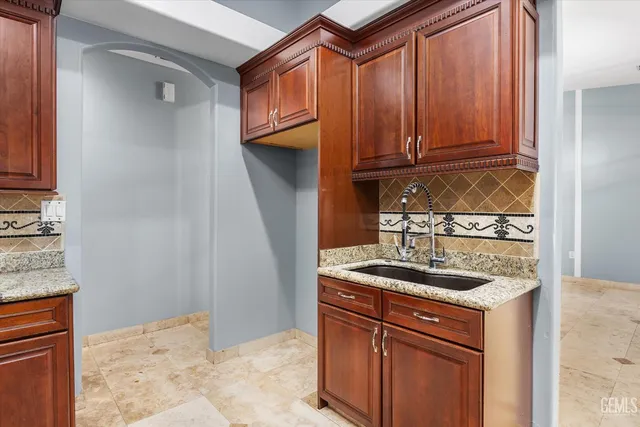 a kitchen with a sink and cabinets