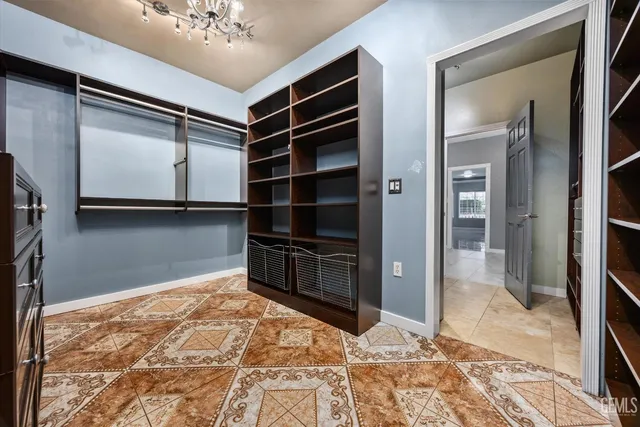 a view of wooden floor and windows in a room