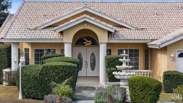 a front view of a house with garden