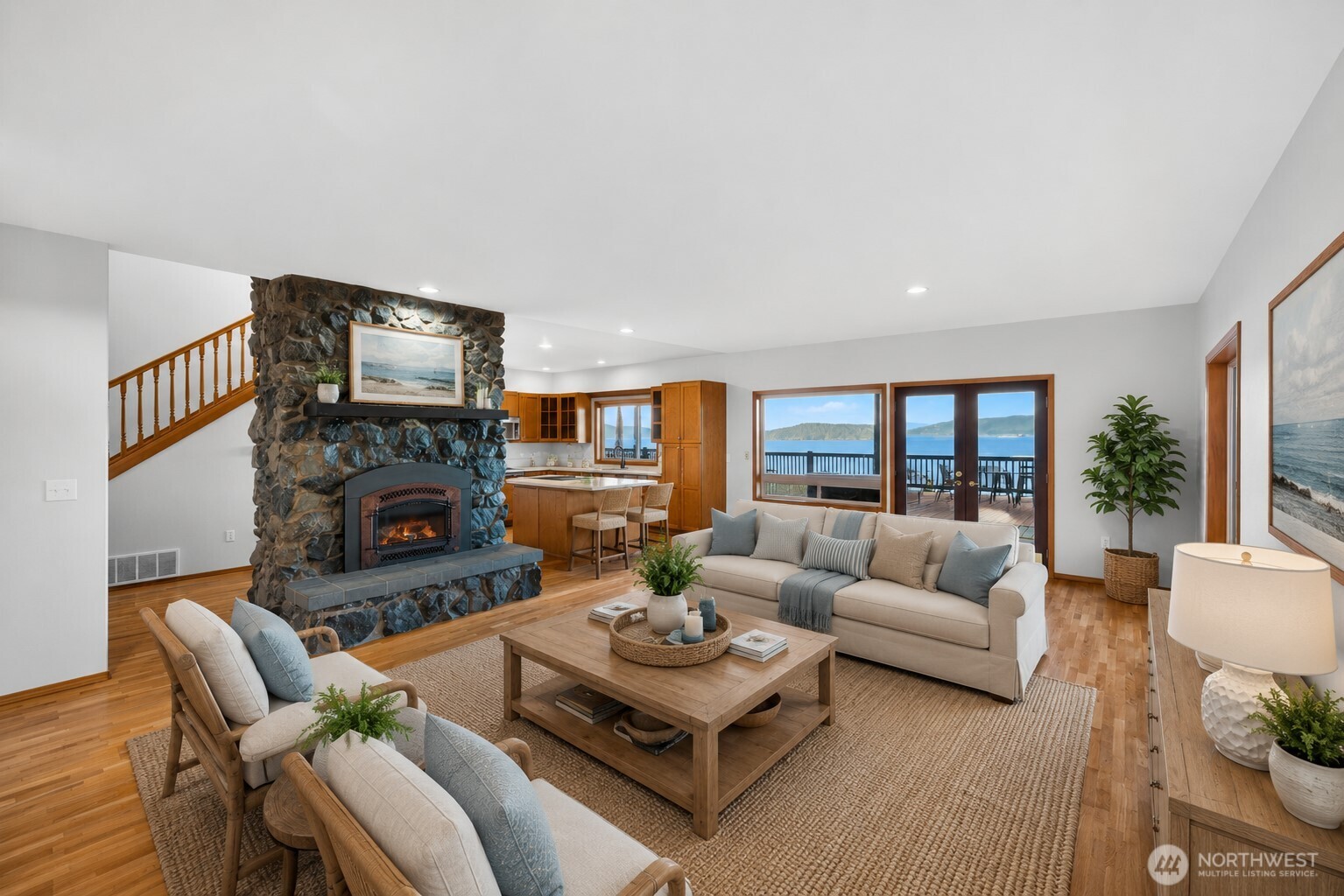 4623 Guemes Island Road Anacortes, WA 98221 - Photo 11 of 40 a living room with furniture fireplace and a flat screen tv