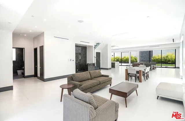 a spacious bathroom with a double vanity sink and a large mirror