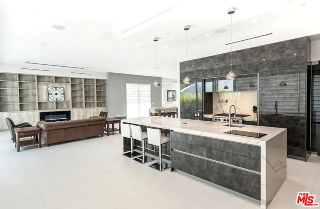a large kitchen with a table and chairs