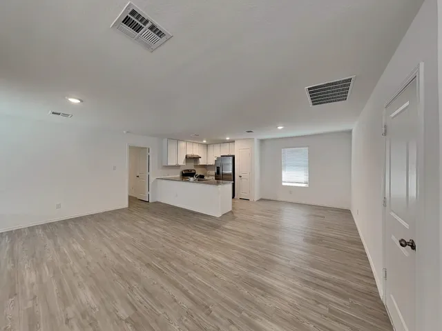 a view of a livingroom with wooden floor