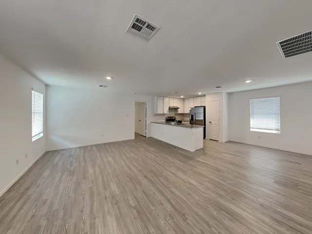 a view of kitchen and wooden floor
