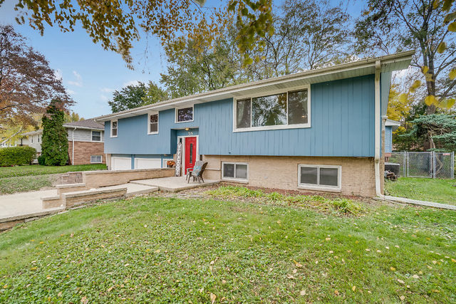 59 Neil Road Sugar Grove, IL 60554 - Photo 1 of 22 a backyard of a house with table and chairs