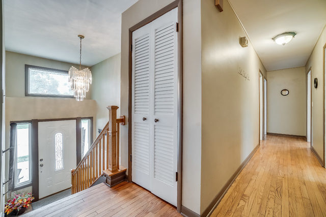 59 Neil Road Sugar Grove, IL 60554 - Photo 11 of 22 a view of a hallway with wooden floor and staircase