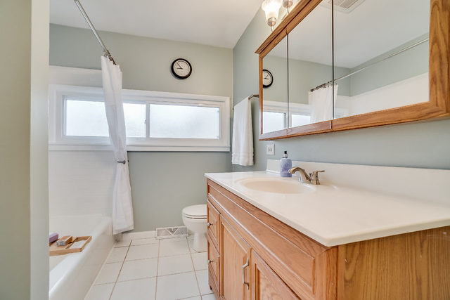 59 Neil Road Sugar Grove, IL 60554 - Photo 12 of 22 a bathroom with a sink and a mirror