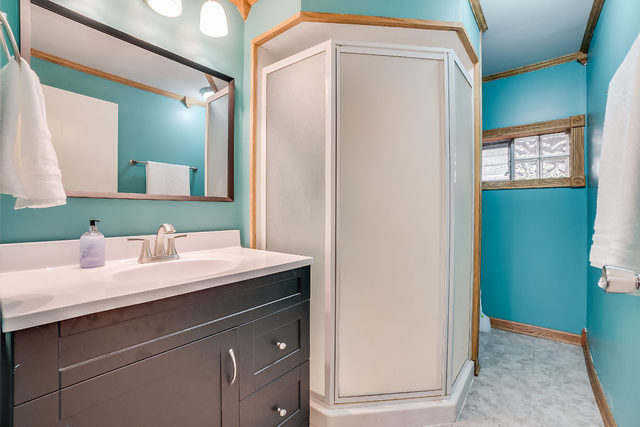 59 Neil Road Sugar Grove, IL 60554 - Photo 17 of 22 a bathroom with a sink and a mirror