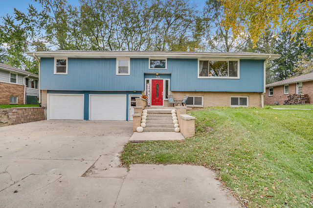59 Neil Road Sugar Grove, IL 60554 - Photo 22 of 22 a front view of a house with a yard and garage