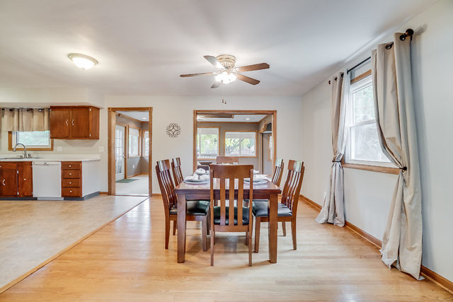 59 Neil Road Sugar Grove, IL 60554 - Photo 5 of 22 a view of a dining room with furniture window and wooden floor