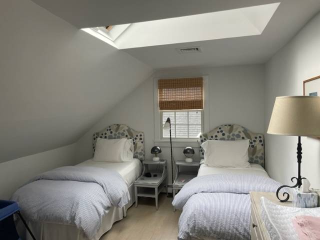 37 Foster Road Quogue, NY 11959 - Photo 9 of 11 a bedroom with a bed and a lamp