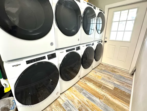 a utility room with dryer and washer