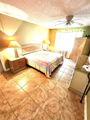 a bathroom with a double vanity sink toilet and shower