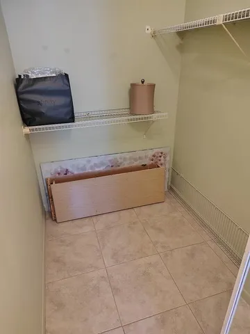 a bathroom with a sink a toilet a tub and shower