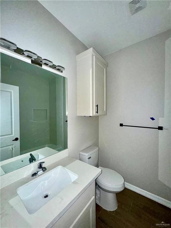 716 Ragland Road, Unit 8 Mission, TX 78572 - Photo 14 of 19 a bathroom with a sink toilet and vanity