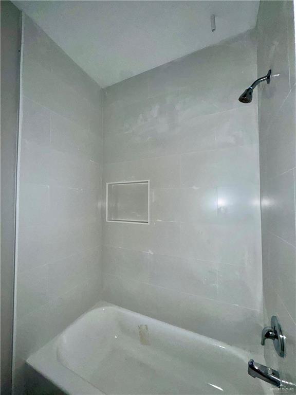 716 Ragland Road, Unit 8 Mission, TX 78572 - Photo 15 of 19 a bathroom with a bathtub