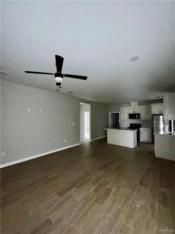 716 Ragland Road, Unit 8 Mission, TX 78572 - Photo 4 of 19 a view of a livingroom with a ceiling fan and hardwood floor
