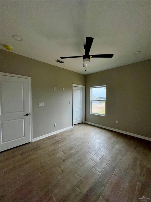 716 Ragland Road, Unit 8 Mission, TX 78572 - Photo 9 of 19 an empty room with a empty space and windows