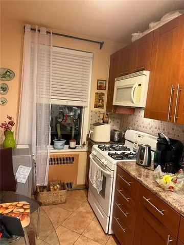 a kitchen with a stove and a microwave