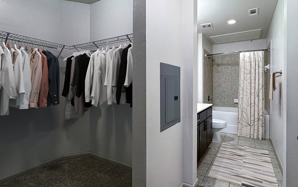 306 McGowen Street, Unit 1121 Houston, TX 77006 - Photo 4 of 20 Enjoy the convenience of a spacious walk-in closet seamlessly connected to the well-appointed primary bathroom, offering generous storage and a functional layout designed for everyday comfort.