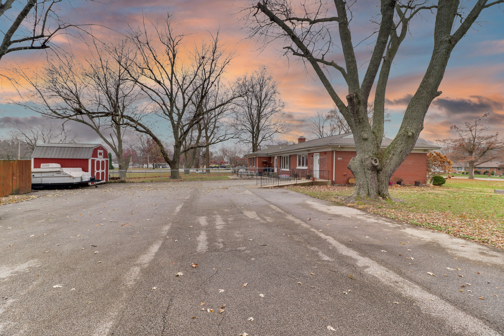900 Beech Street Normal, IL 61761 - Photo 12 of 36 a front view of a house with a yard and large trees