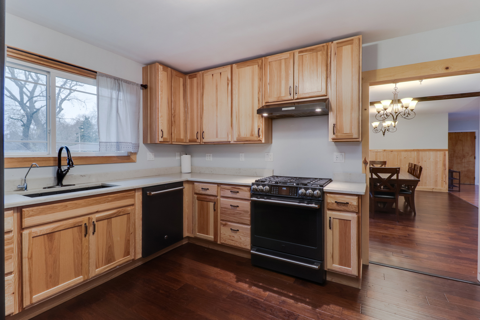 900 Beech Street Normal, IL 61761 - Photo 23 of 36 a kitchen with wooden cabinets and a stove top oven