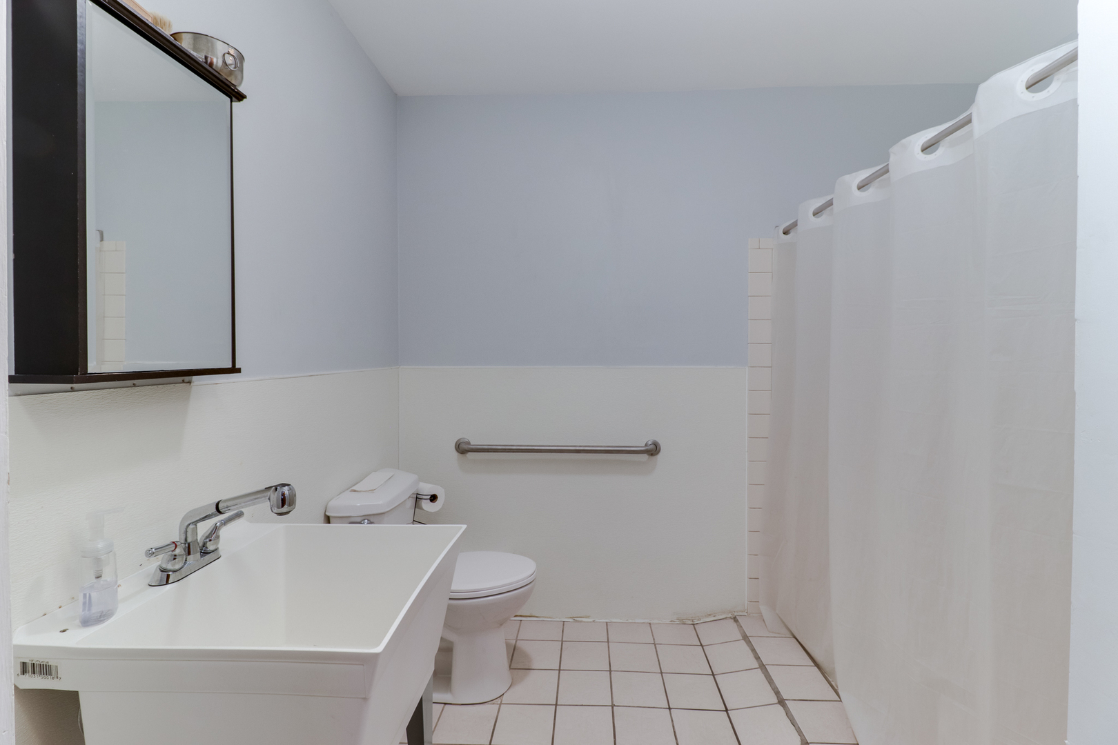 900 Beech Street Normal, IL 61761 - Photo 26 of 36 a bathroom with a sink a toilet and mirror