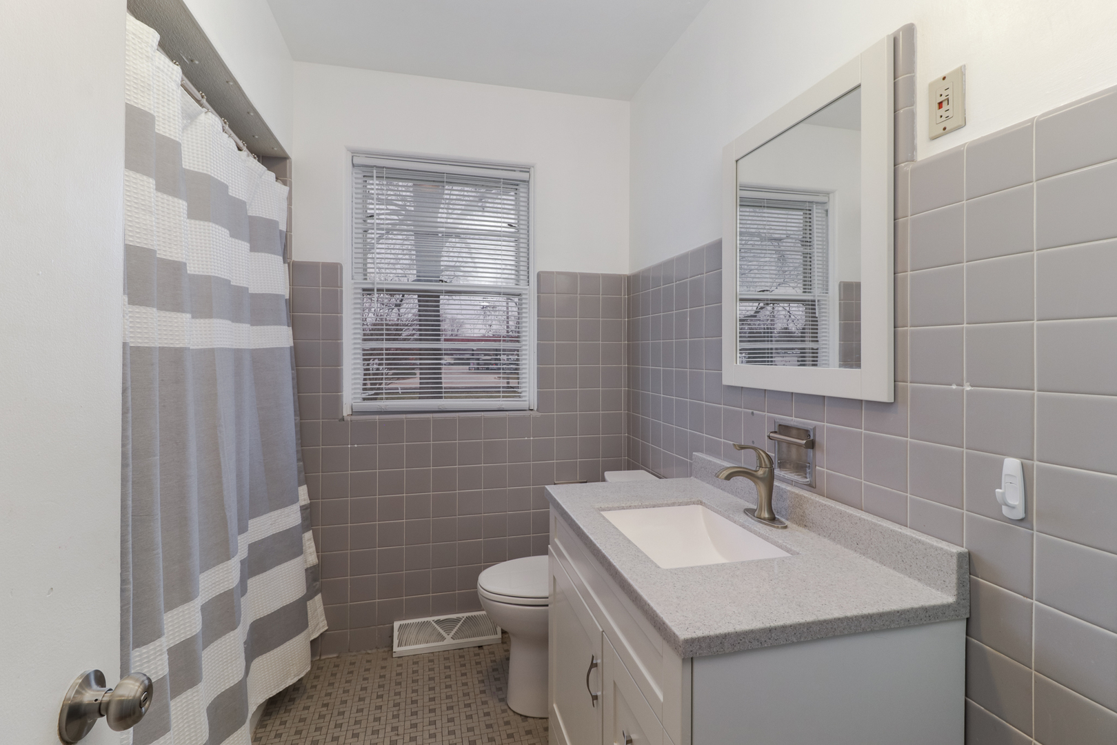 900 Beech Street Normal, IL 61761 - Photo 31 of 36 a bathroom with a sink toilet and vanity