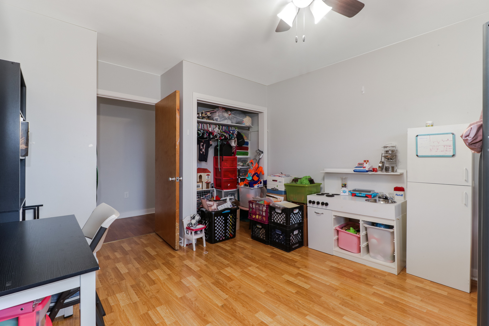 900 Beech Street Normal, IL 61761 - Photo 32 of 36 a bed room with a bed and a chandelier