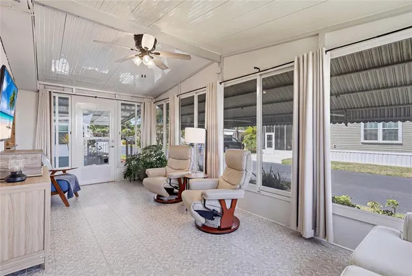 a room with furniture and a large window