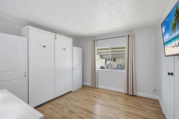 a view of a hardwood floor in a room