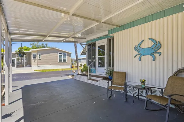 a swimming pool with outdoor seating and yard