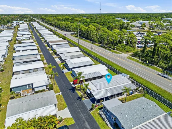 an aerial view of a residential houses with city view