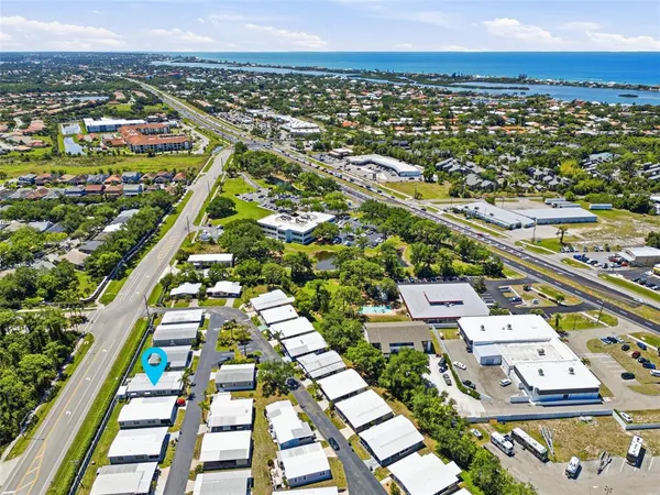 an aerial view of residential houses with outdoor space