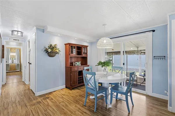 a view of a dining room with furniture and wooden floor
